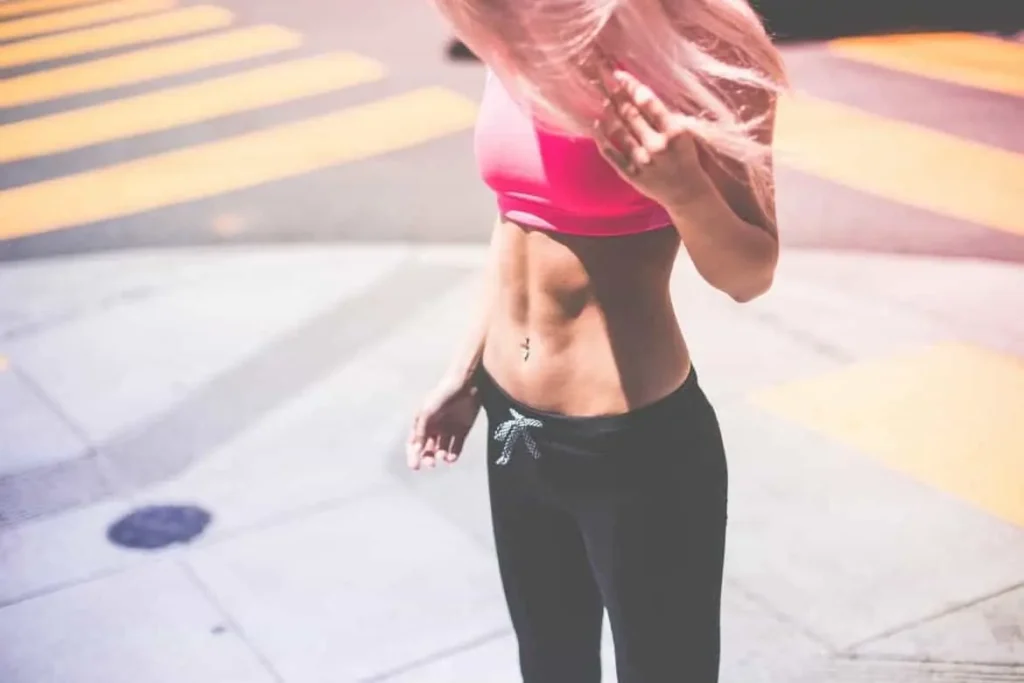 Woman with toned stomach after LA-EMS Body Sculpting Treatment Barry 